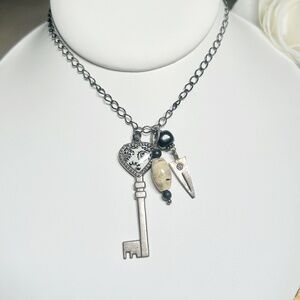 Black & White Scrolled Heart Skeleton Key Pendant with Shell & Arrow Charms